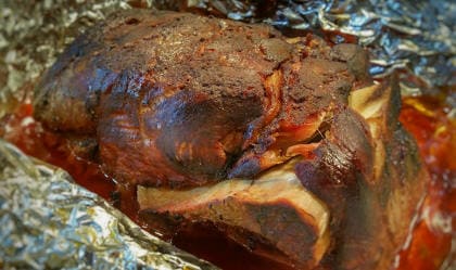 Pork butt wrapped in foil with soda
